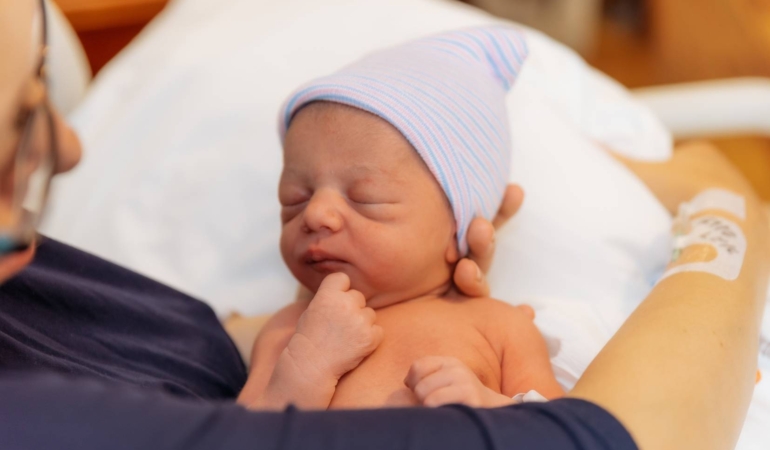 young-millennial-mother-holding-
